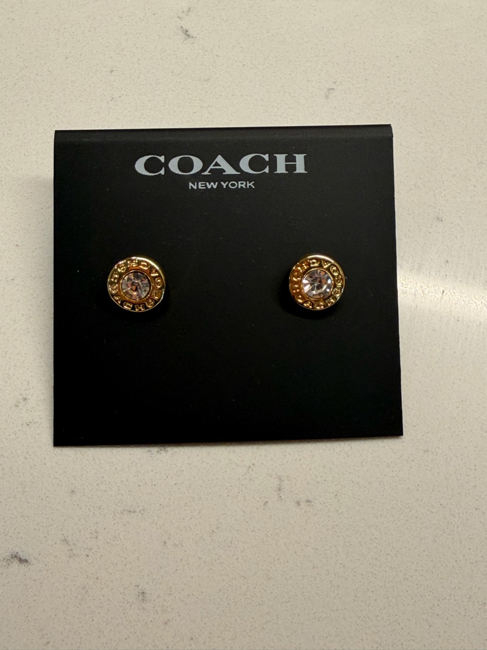 Coach Gold-Tone Logo Crystal Stud Earrings - Clear Crystal
